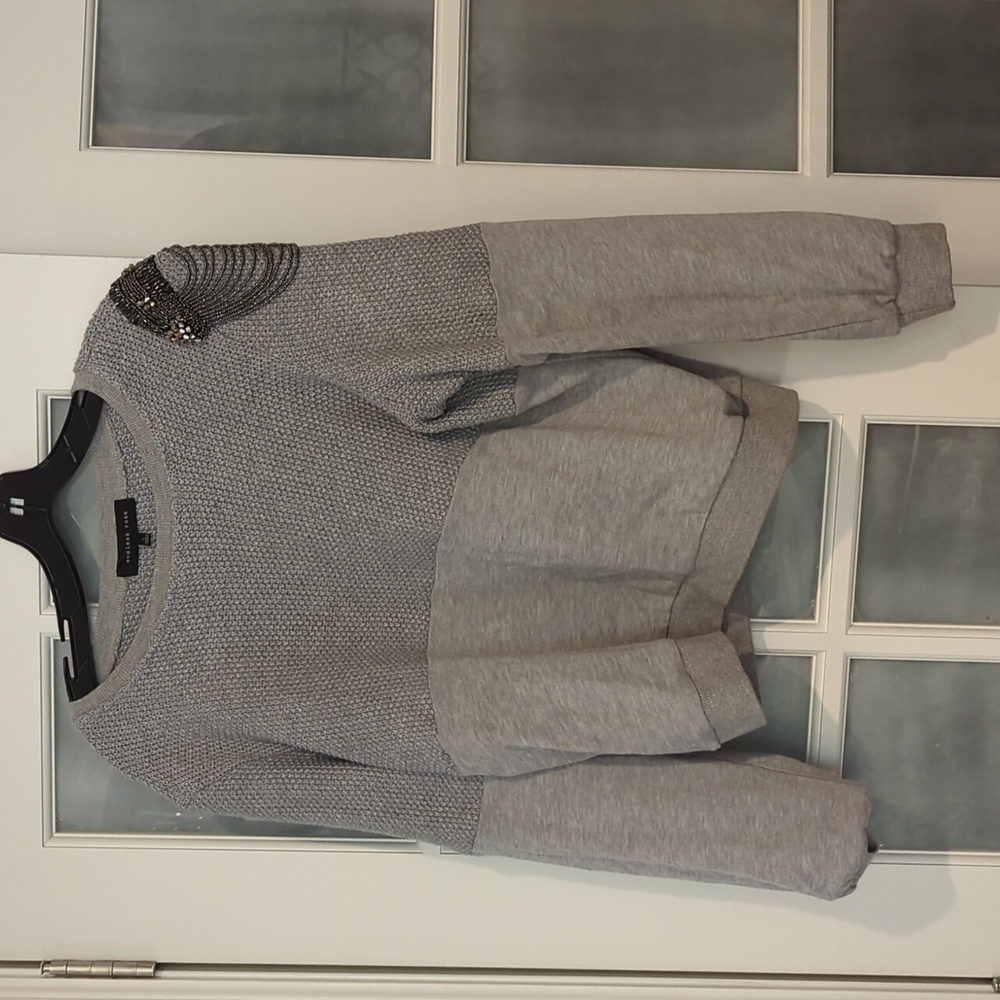 Mixed media sweater with shoulder detail